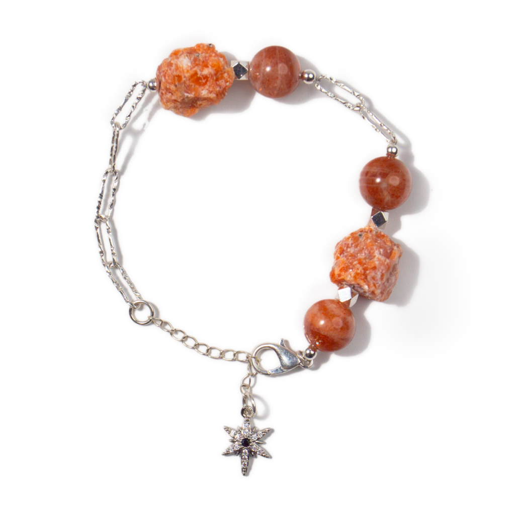 Wearing strawberry quartz bracelet on left hand for self love