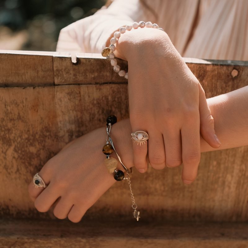 Grounding Jewelry: 5 Powerful Stones to Find Calm in Chaos 3 Wearing grounding crystal bracelet on left hand